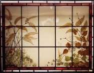 Trompe-l'oeil window with foliage, view from outside.